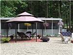 View larger image of Patio area with picnic table at FRIENDLY BEAVER CAMPGROUND image #9