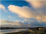 White clouds over a shoreline nearby at SHORELINE RV PARK - thumbnail