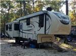 A fifth wheel parked at a deluxe site at ATLANTIC BLUEBERRY RV PARK - thumbnail