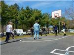 People playing on the basketball court at ATLANTIC BLUEBERRY RV PARK - thumbnail