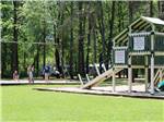 People playing on the playground equipment at APPLE CREEK CAMPGROUND & RV PARK - thumbnail