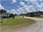 A row full of gravel RV sites at MONTGOMERY SOUTH RV PARK & CABINS - thumbnail