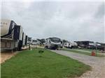 Trailers and motorhomes parked in gravel sites at MONTGOMERY SOUTH RV PARK & CABINS - thumbnail