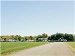 Man walking on a park road at Timbercrest Camp and RV Park - thumbnail