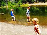 Three young girls playing in the river at LONE MOUNTAIN RESORT - thumbnail