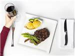 Steak, asparagus and glass of red wine at SKY UTE CASINO RV PARK - thumbnail