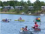 View larger image of Kids boating at DAVIS LAKES RV PARK AND CAMPGROUND image #6