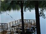 View larger image of Trees in front of a dock at DAVIS LAKES RV PARK AND CAMPGROUND image #11