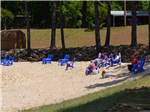 View larger image of People on the steep beach at DAVIS LAKES RV PARK AND CAMPGROUND image #12