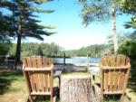 Adirondack chairs on the waterfront at PINEWOOD LODGE CAMPGROUND - thumbnail