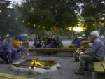 Folks sitting around a fire pit - thumbnail