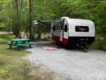 Trailer and green picnic table - thumbnail