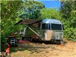 An Airstream in a dirt RV site at SHADY KNOLL CAMPGROUND - thumbnail
