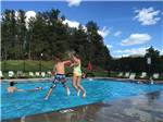 Kids swimming in pool at RAFTER J BAR RANCH CAMPING RESORT - thumbnail