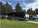 Big rig in site with large grass area at RAFTER J BAR RANCH CAMPING RESORT - thumbnail