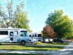 Parked RV's at site Yogi Bear's Jellystone Park at Pine Lakes - thumbnail