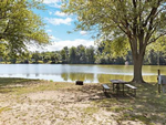 Water by the site at Yogi Bear's Jellystone Park at Pine Lakes - thumbnail