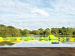 Lake with water play area on it at Yogi Bear's Jellystone Park at Pine Lakes - thumbnail