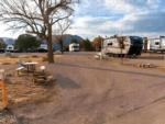 RVs parked in sites with tables at Royal Gorge RV Resort & Cabins - thumbnail