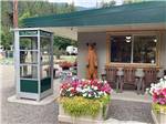 Campground office with telephone booth and bear statue at CAMPGROUND ST REGIS - thumbnail