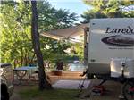 View larger image of One of the campsites by the water at SID TURCOTTE PARK CAMPING AND COTTAGE RESORT image #1