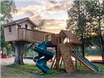 View larger image of A playground with a tree house at SID TURCOTTE PARK CAMPING AND COTTAGE RESORT image #4
