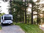 View larger image of A motorhome in a gravel RV site at SID TURCOTTE PARK CAMPING AND COTTAGE RESORT image #8