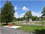 View larger image of A row of RV sites with picnic benches at CAMP HITHER HILLS image #12