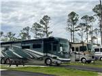 View larger image of RVs parked in gravel sites at FLORIDA CAVERNS RV RESORT AT MERRITTS MILL POND image #10