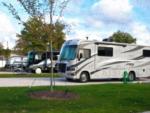 Parked RV's at site Sun Retreats Geneva on the Lake - thumbnail