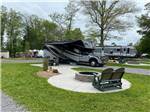 View larger image of A fire pit by a gravel RV site at SKYLINE RV RESORT image #2