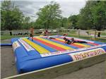 View larger image of Kids playing on the jumping pad at SKYLINE RV RESORT image #3