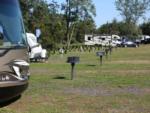 A row of RV sites with fire pits at BLACK BEAR RV PARK - thumbnail