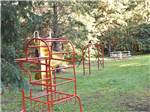 The metal playground equipment at HAPPY LAND RV PARK - thumbnail