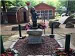 A statue of a little boy at HIDDEN ACRES FAMILY CAMPGROUND - thumbnail