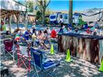 View larger image of People sitting outside eating at BEACON HILL CAMPING image #7
