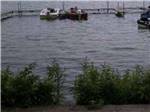 A couple of boats docked at ARBOR VITAE CAMPGROUND - thumbnail