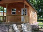 A rental cabin with a porch - thumbnail