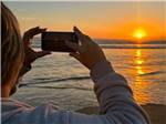 A photo being taken of the sunset - thumbnail