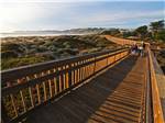 A wooden walkway leading to the beach - thumbnail