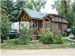 View larger image of One of the rustic rental cabins at RIVERVIEW RV PARK  CAMPGROUND image #6