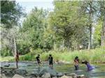 Playing in a creek at Riverview RV Park & Campground - thumbnail