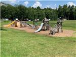 View larger image of Playground surrounded by grass at LAKE PEMAQUID CAMPGROUND image #5