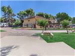 RV lot near building and pool - thumbnail