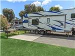 RV near grass and picnic table - thumbnail