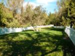 A white fenced area at WOODS VALLEY KAMPGROUND & RV PARK - thumbnail
