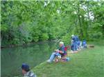 A group of people fishing on the river at ELKHORN CREEK RV PARK - thumbnail