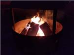 A fire in the fire pit at KLAMATH CAMPER CORRAL - thumbnail