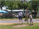 People playing horseshoes at HAT ROCK CAMPGROUND - thumbnail