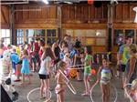View larger image of A group of kids hula hooping at LONE PINE CAMPSITES image #11